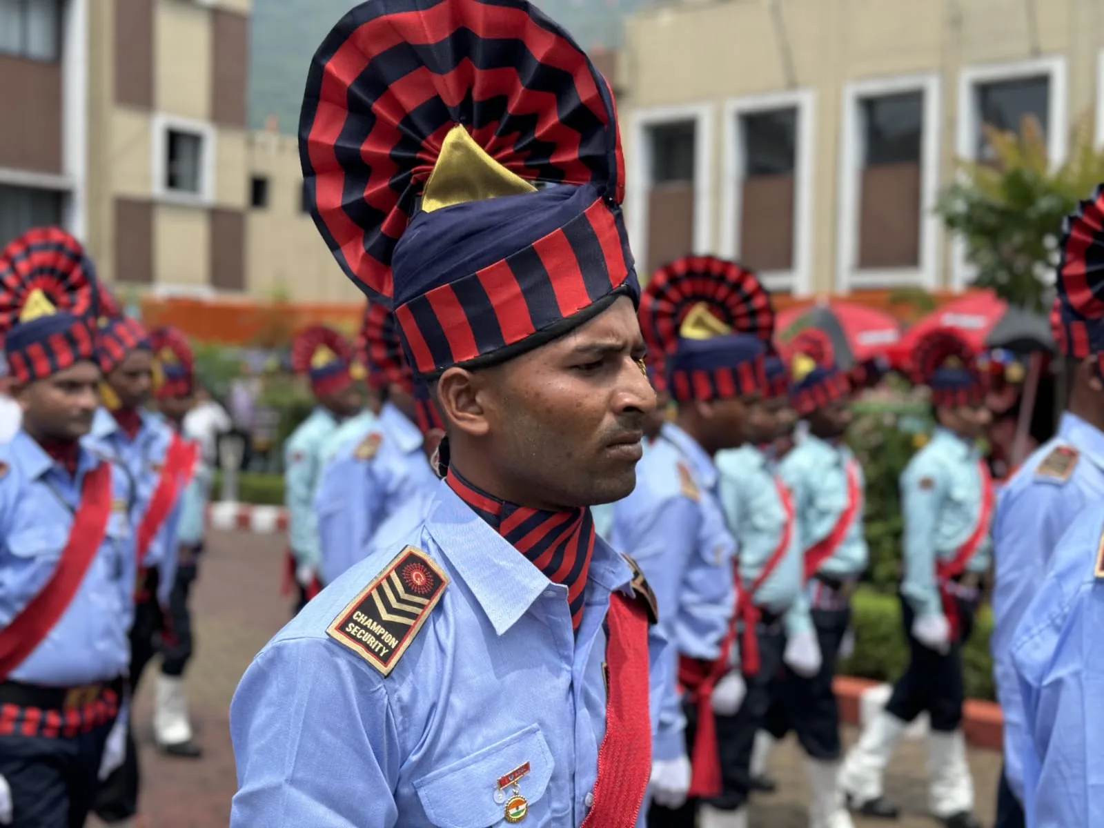 Champion Security officer with team members in the background