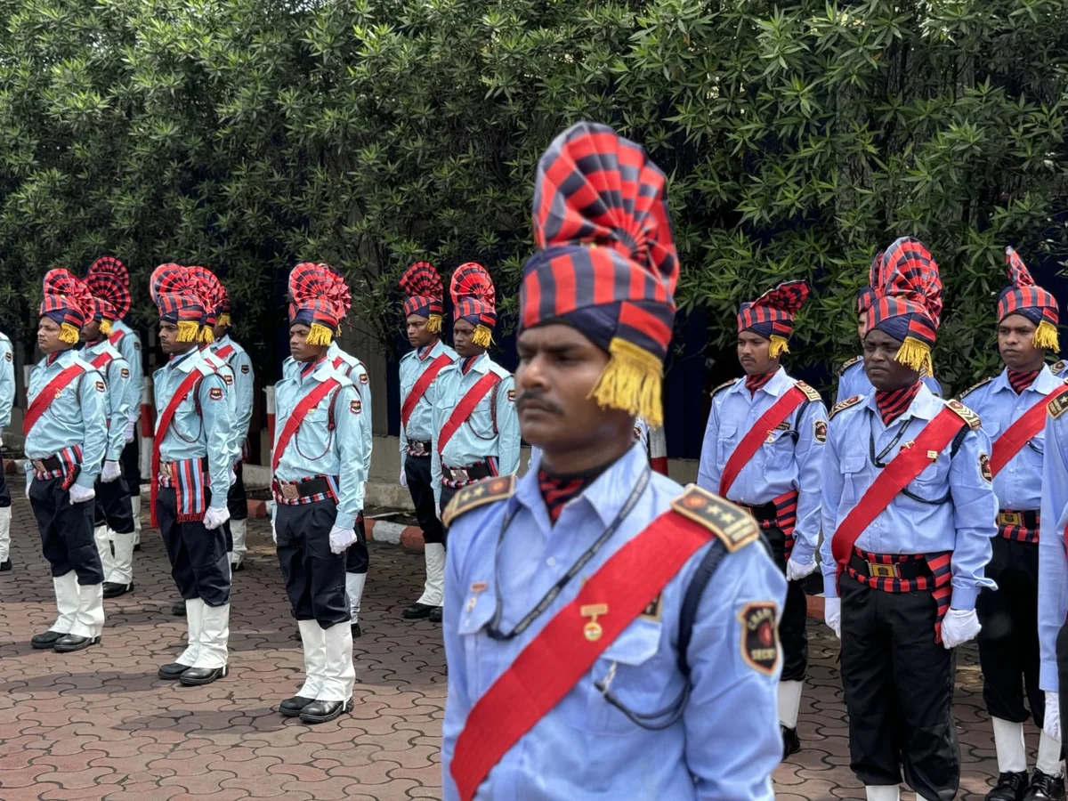 Uniformed security personnel standing in parade formation